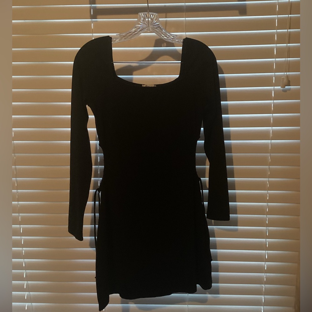 Long Sleeve black dress, with openings on the side